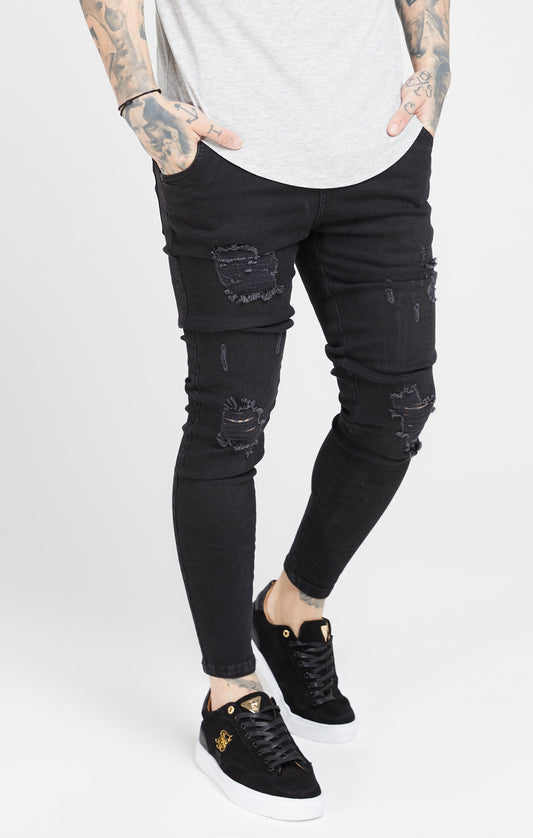 Schwarze Skinny Jeans in Distressed Optik